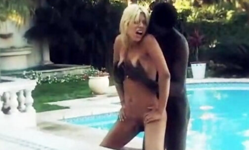 Black and white chap and tranny poolside fun