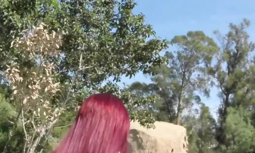 Red hair transbabe shows tits outdoors