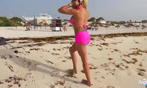Busty blonde trans in a pink bikini and booty shorts