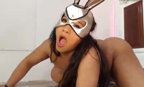 chubby shemale in mask shows off her big ass