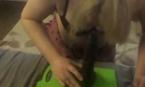 Blonde transgirl practices blowjob skills on dildo