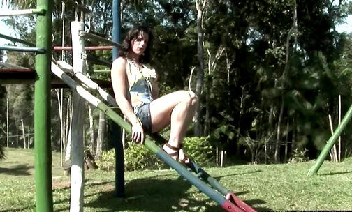 Girlish tranny gets naked and strokes in public playground