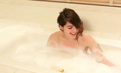 Solo trans woman teases while bathing