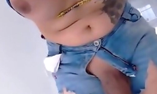 tramp tranny in muscular jeans jerks her penis
