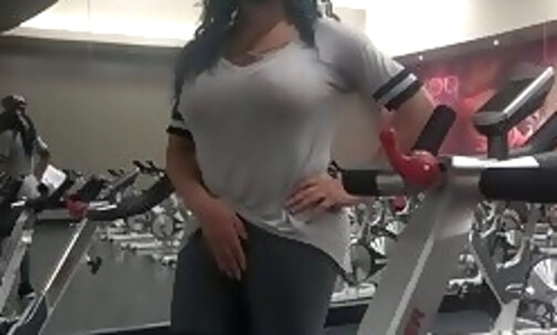 Stroking her big cock in the gym and shooting a cumshot