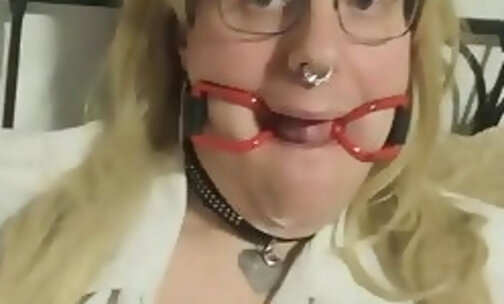 Tranny school girl in a ring gag and Chastity