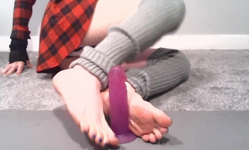 Dildo footjob with soles and toe spreading.