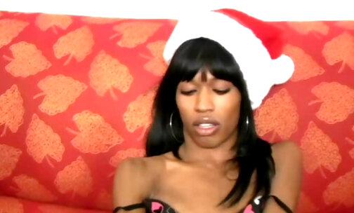 Black t-girl inserts xmas toy deep inside her butt hole