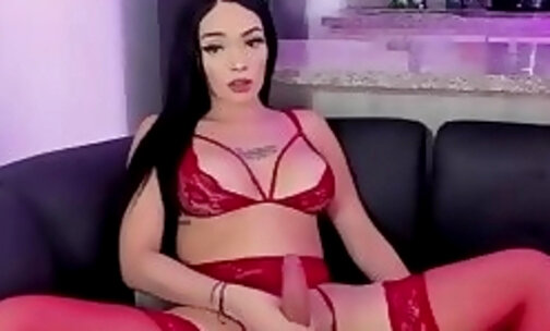 adorable trans doll in sexy red lingerie and stockings jerks on webcam