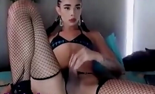 big ass latina tattooed tgirl in fishnet stockings tugs her dick