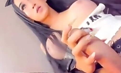 Pretty busty Shemale Faps Her Huge Cock.