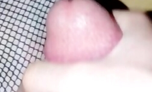Sissy in black fishnets masturbating and cumming on her foot