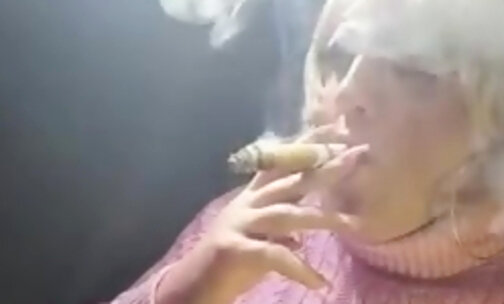 Tgirl Virginia smoking a big cigar