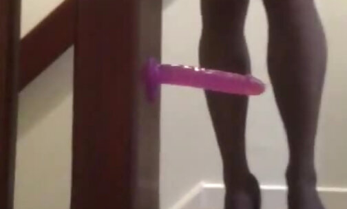 Crossdresser fucks a dildo in stockings and heels