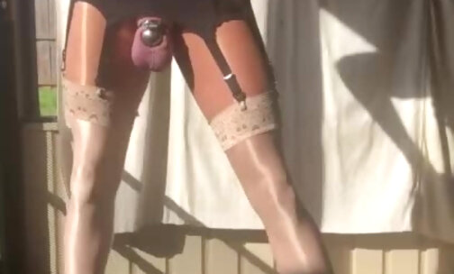 Smoking sissy faggot slapping her ovaries while caged - glossy nylon, platform heels, micro chastity
